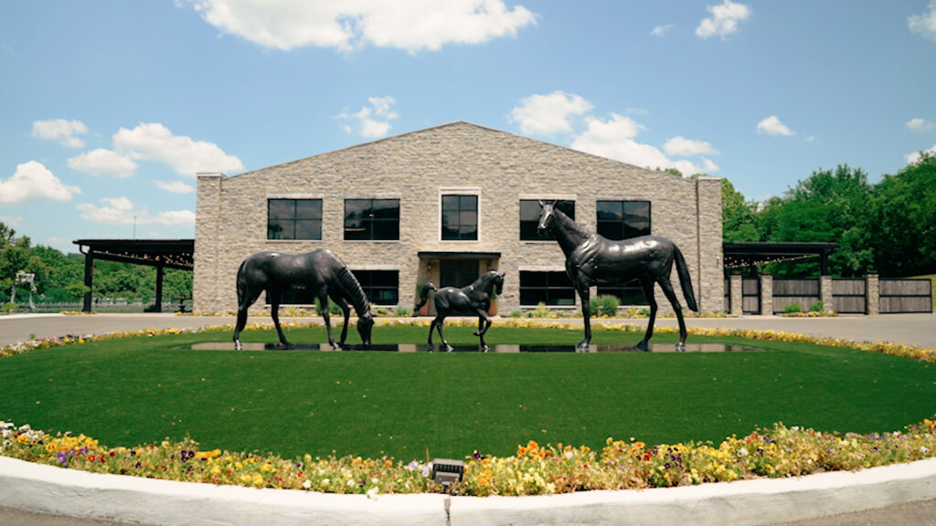 Front of venue, horse statues with entrance on a sunny day